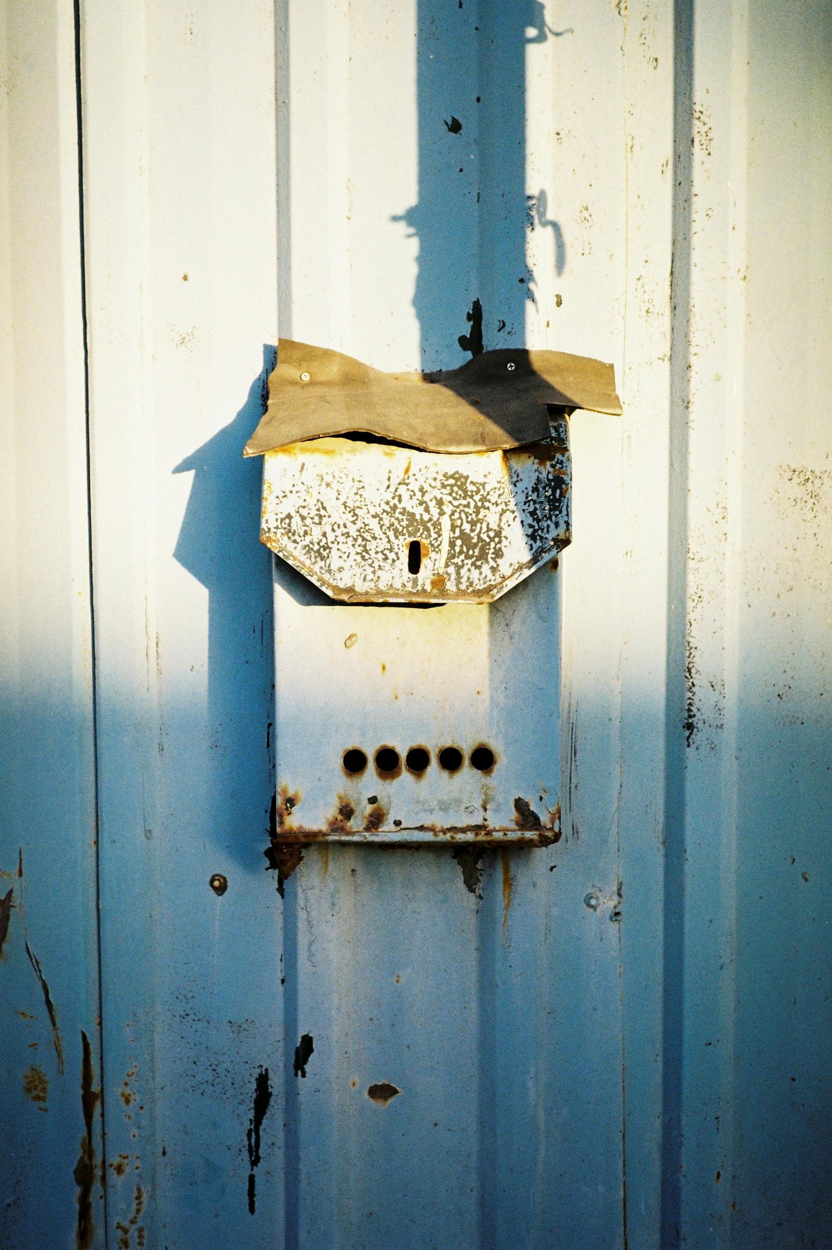 Old Post Box on Iron Doors