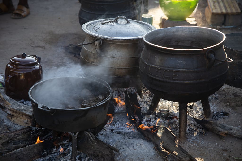 Three-legged Cast Iron Pots on Fire